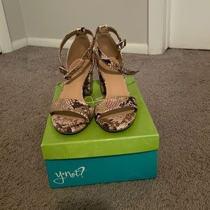 Gold with leopard pattern. Thick cake heel with open toe and ankle straps.